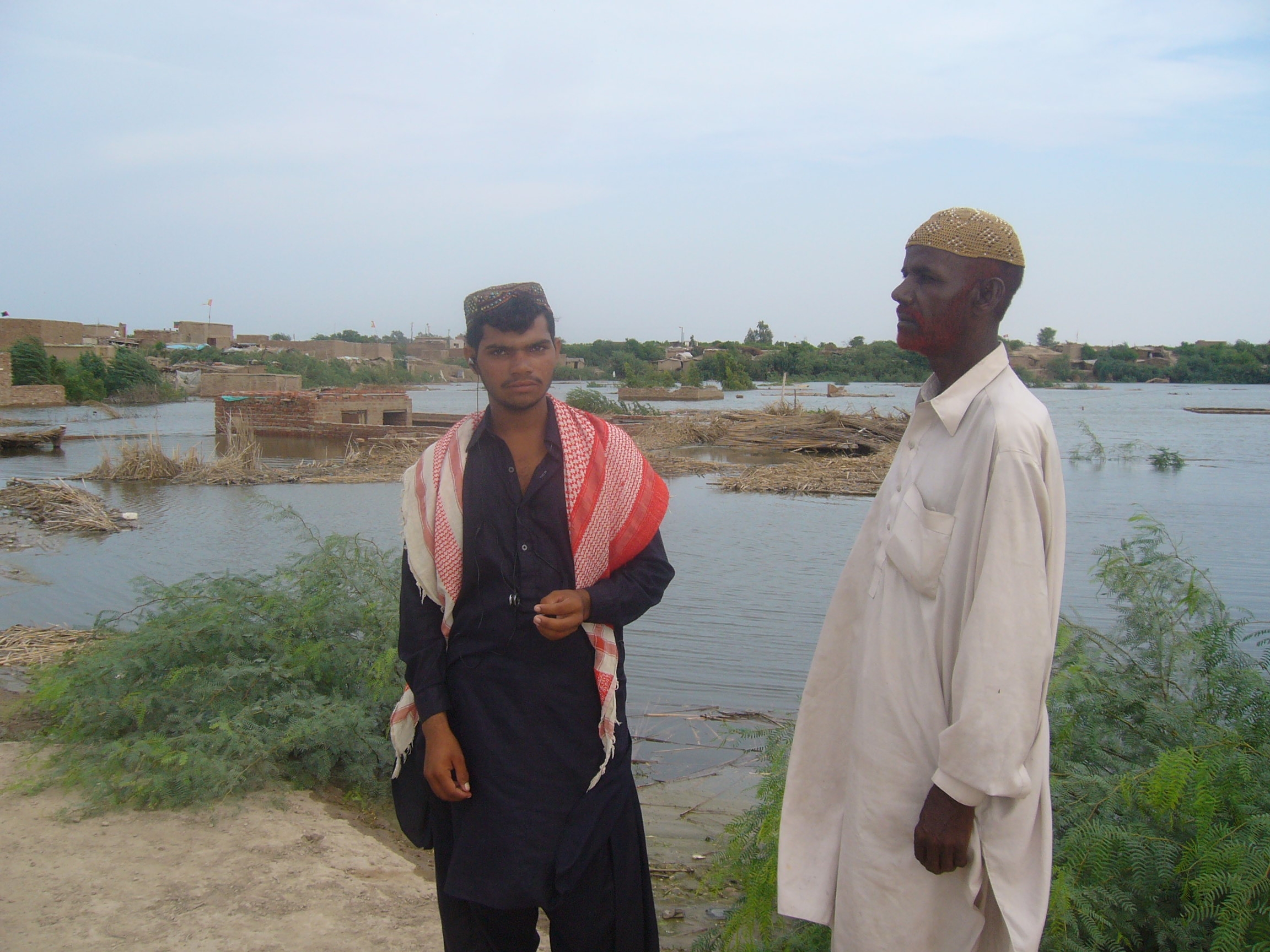 Affected people with their houses plunged under the flood waters