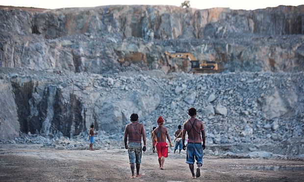 Indigenous Munduruku men survey the quarry site for the Belo Monte dam.